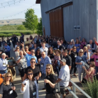 Convention attendees raise a toast to 50 years of WSAE at the Hackett Ranch in Yakima Valley